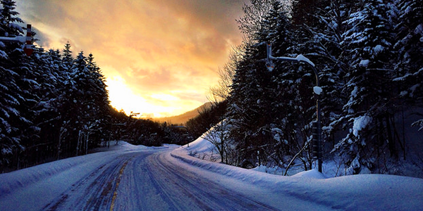 snowy road at sunset