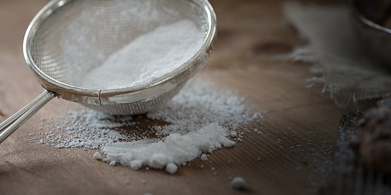 Powdered sugar in a sifter