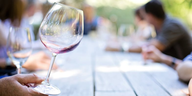 Wine glass on a picnic table
